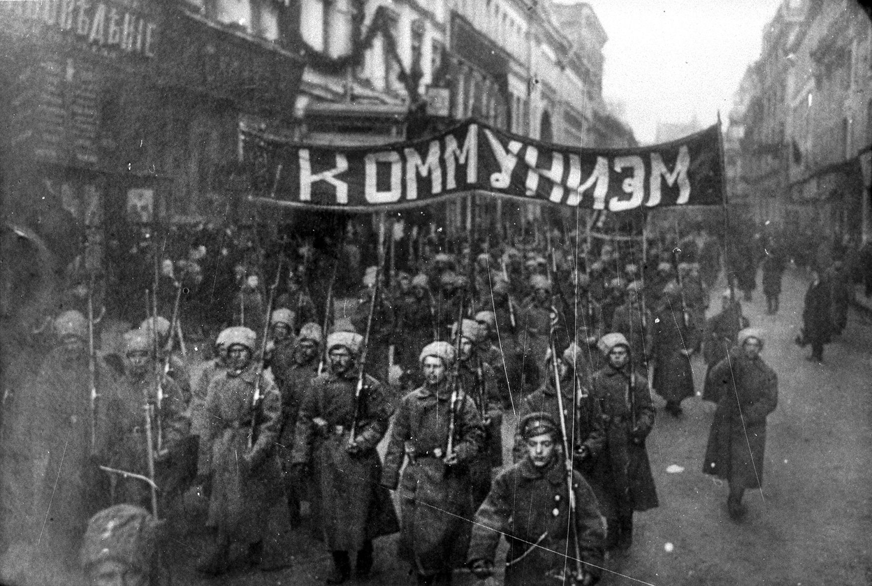 Armed_soldiers_carry_a_banner_reading_'Communism',_Nikolskaya_street,_Moscow,_October_1917